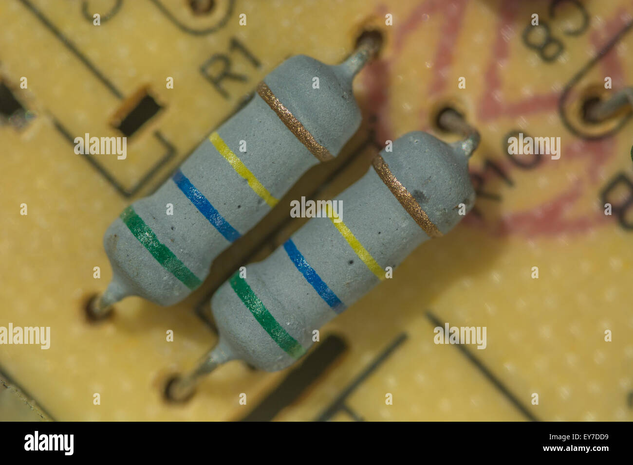 Macrophoto of ceramic resistors on a throughhole printed circuit
