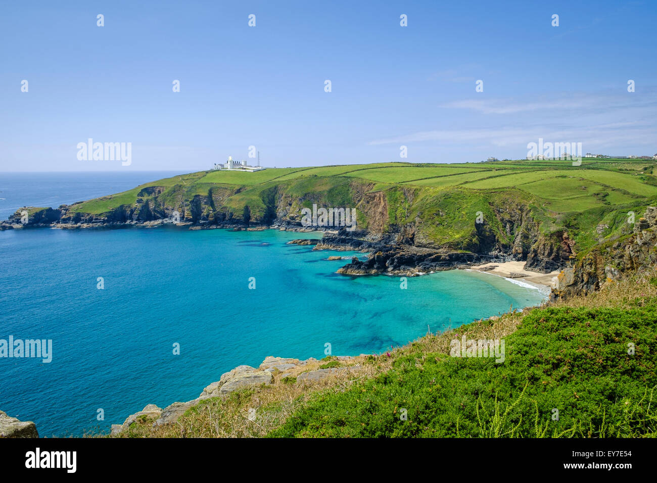 Lizard Point Lighthouse and Lizard village from the South West Coast Path near Housel Bay, West Cornwall, England, UK Stock Photo