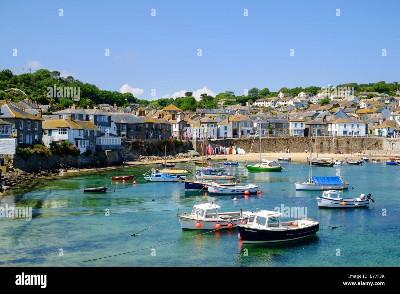 Old fishing village of Mousehole with fishing boats in the harbor, West Cornwall, England, UK Stock Photo