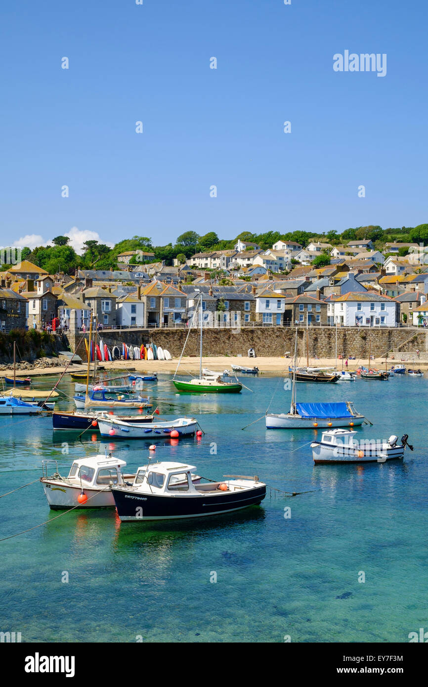 Mousehole Cornwall village with fishing boats in the harbour, West Cornwall, England, UK Stock Photo