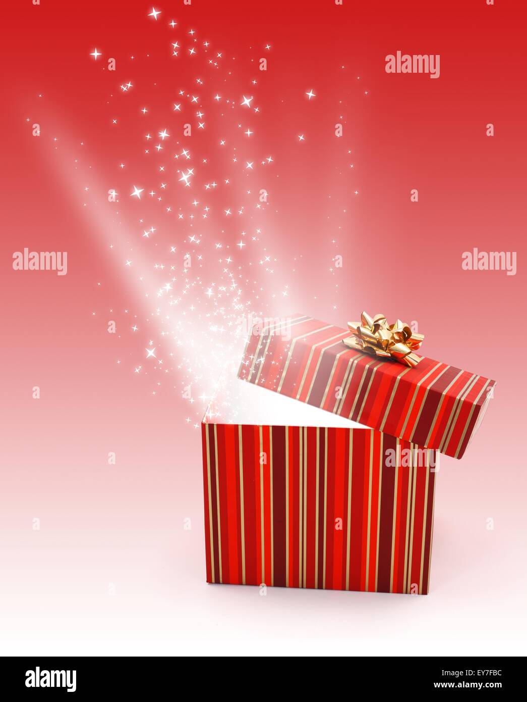 Streaking light and wonder stars coming out from half open gift box Stock Photo