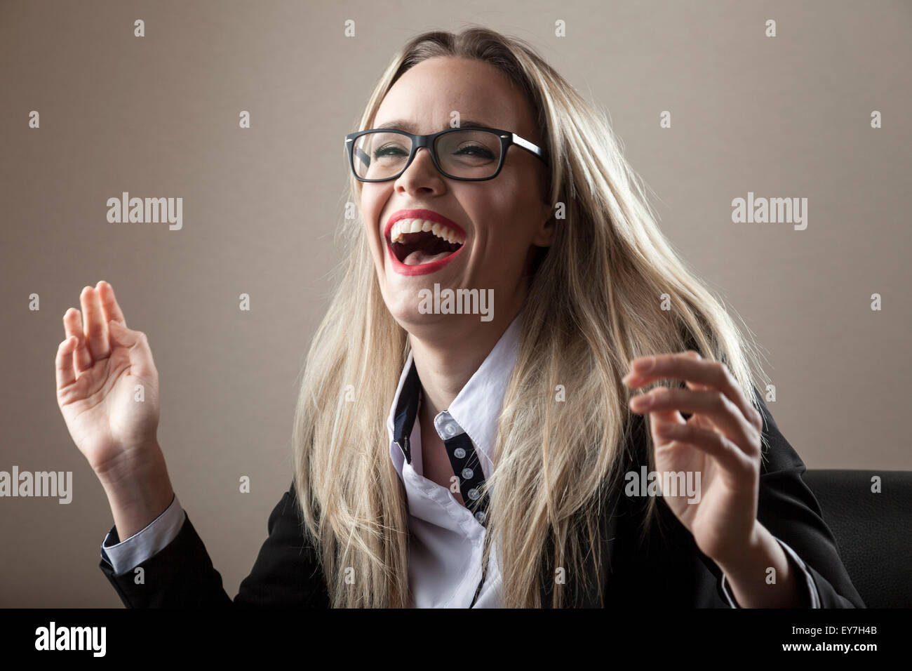 Businesswoman laughing cheerfully Stock Photo