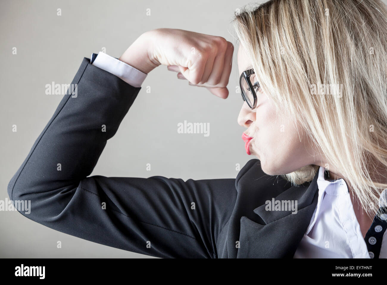 Businesswoman pursing lips and clenching fist Stock Photo