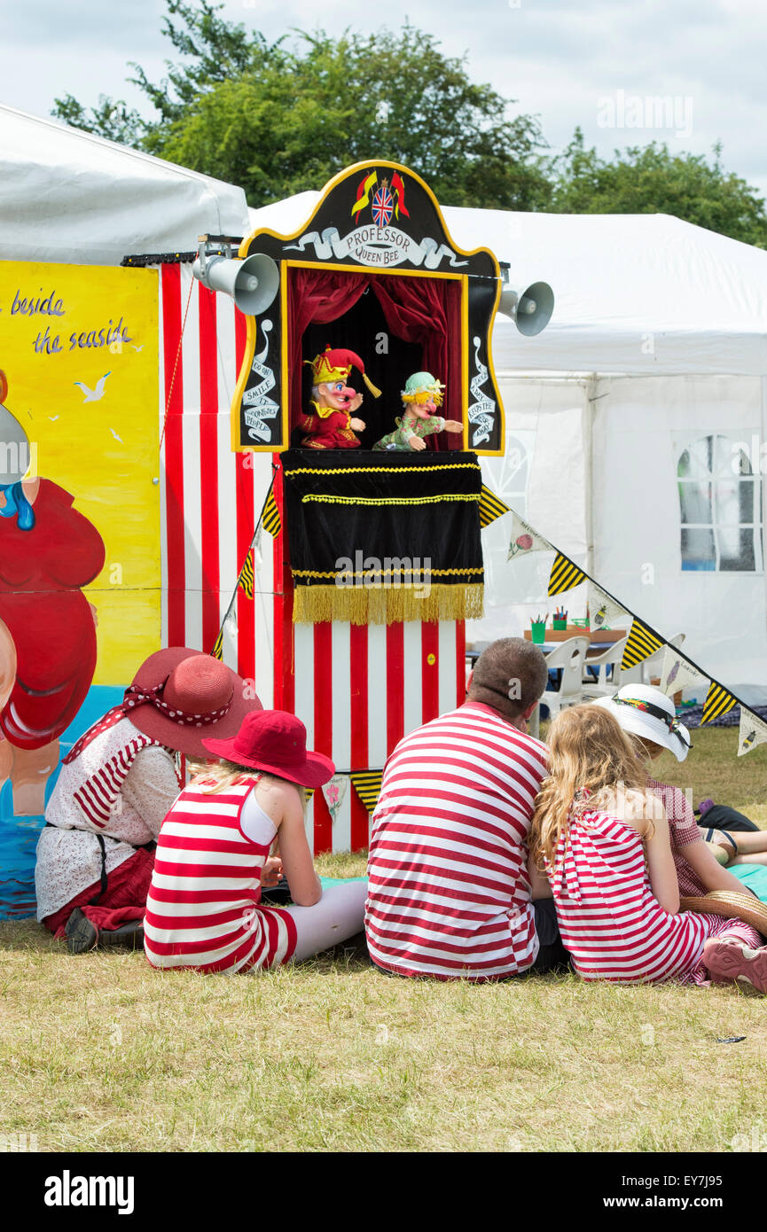 People watching a Punch and Judy Show at the Thames Traditional Boat Festival, Fawley Meadows, Henley On Thames, England Stock Photo