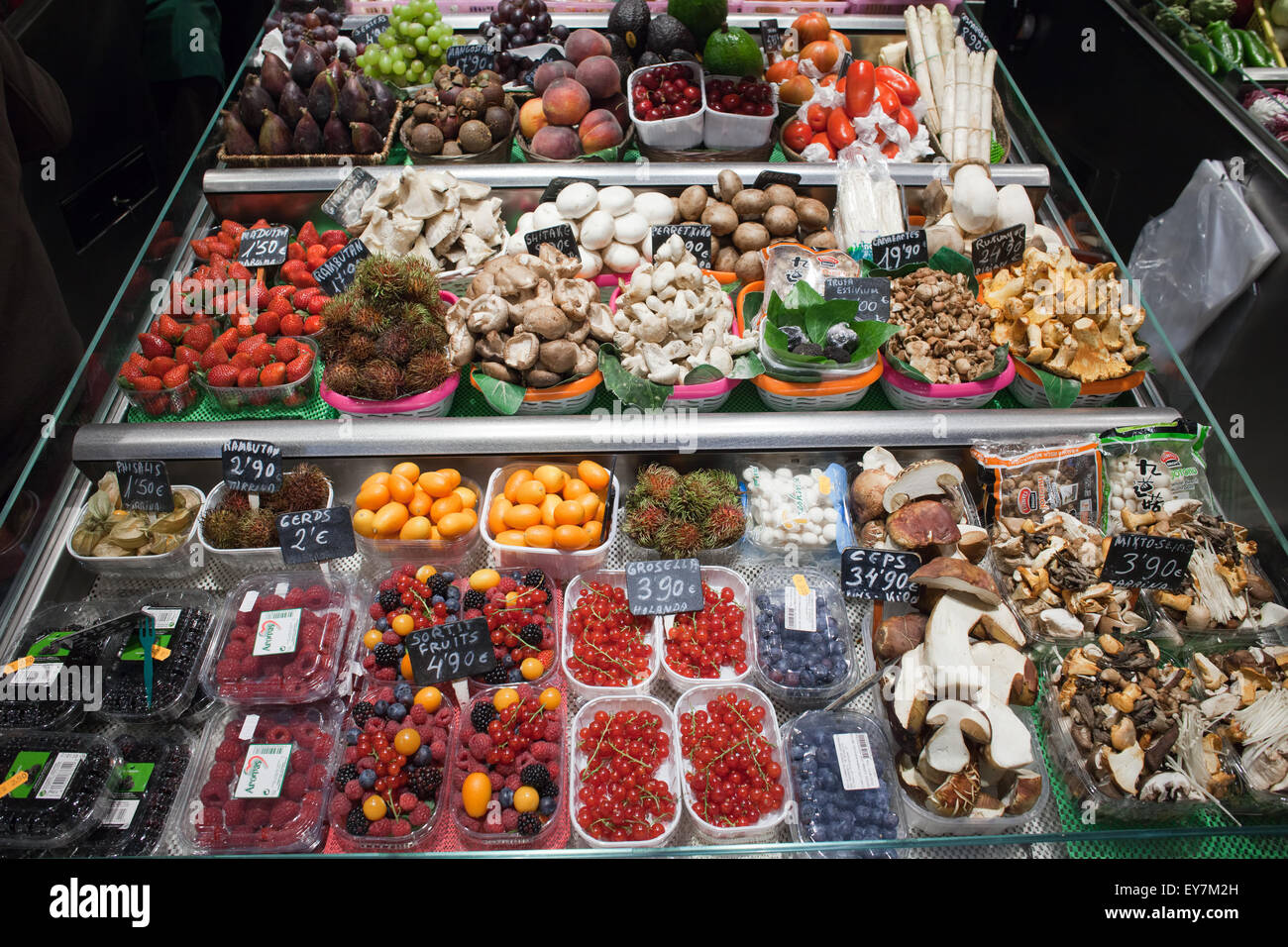 Fruits and mushrooms in La Boqueria food market in Barcelona, Catalonia