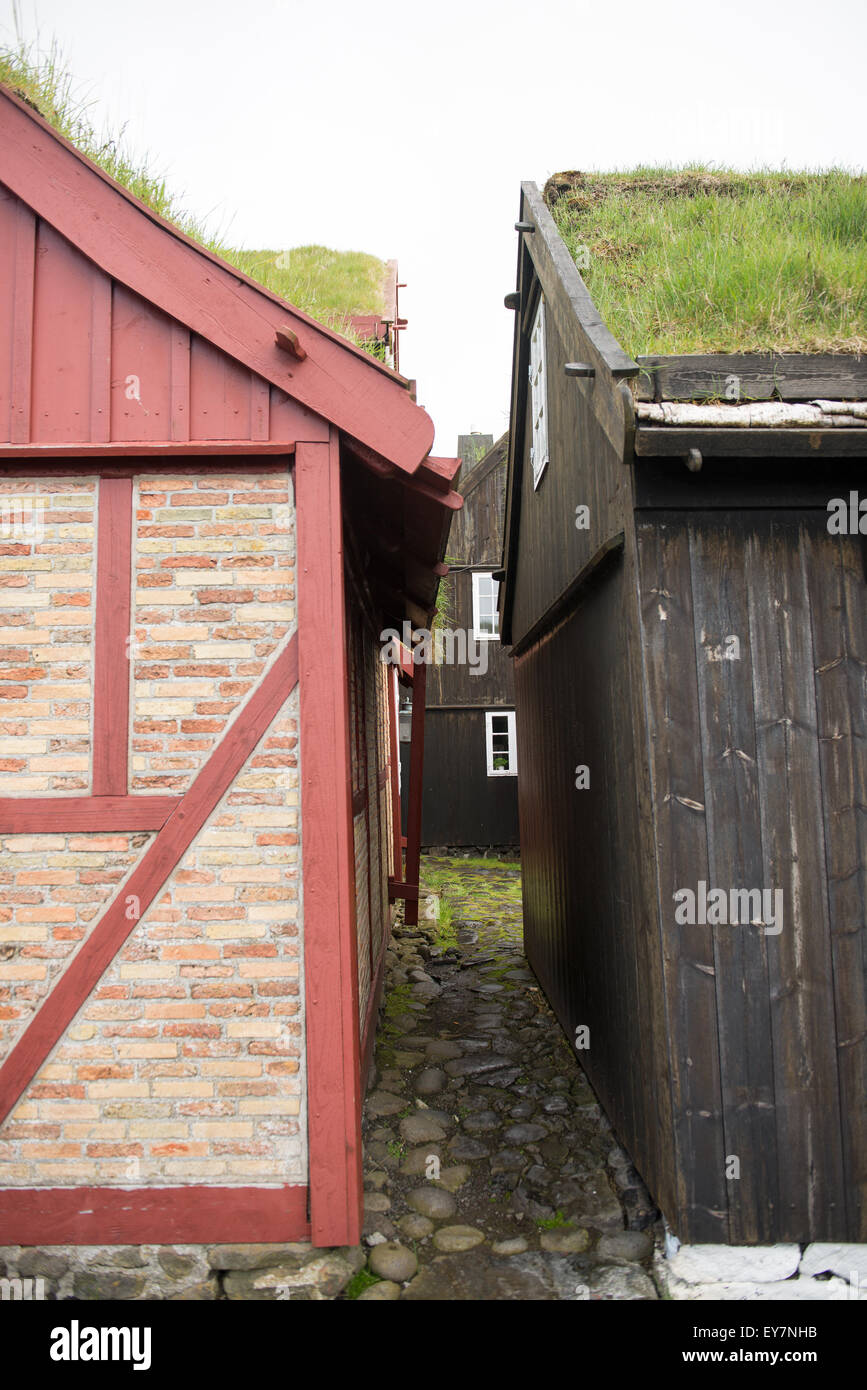 Small roads in the old town of Torshavn with black old wooden houses Stock Photo