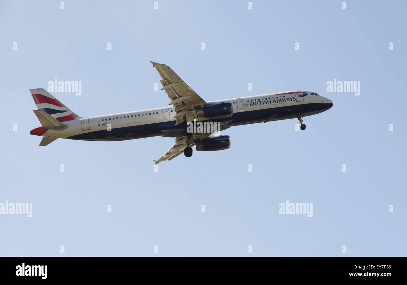 British Airways A321 passenger jet with gear down ready for landing West London UK Stock Photo