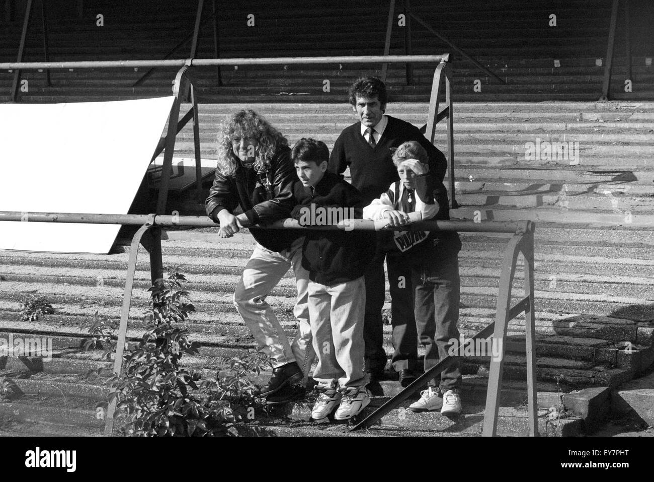 Robert Plant and his son Logan stand on the derelict North Bank (Cow Shed) at Molineux stadium home of Wolverhampton Wanderers football club for the last time. WOLVES V BARNSLEY AT MOLINEUX 5/10/91 Stock Photo