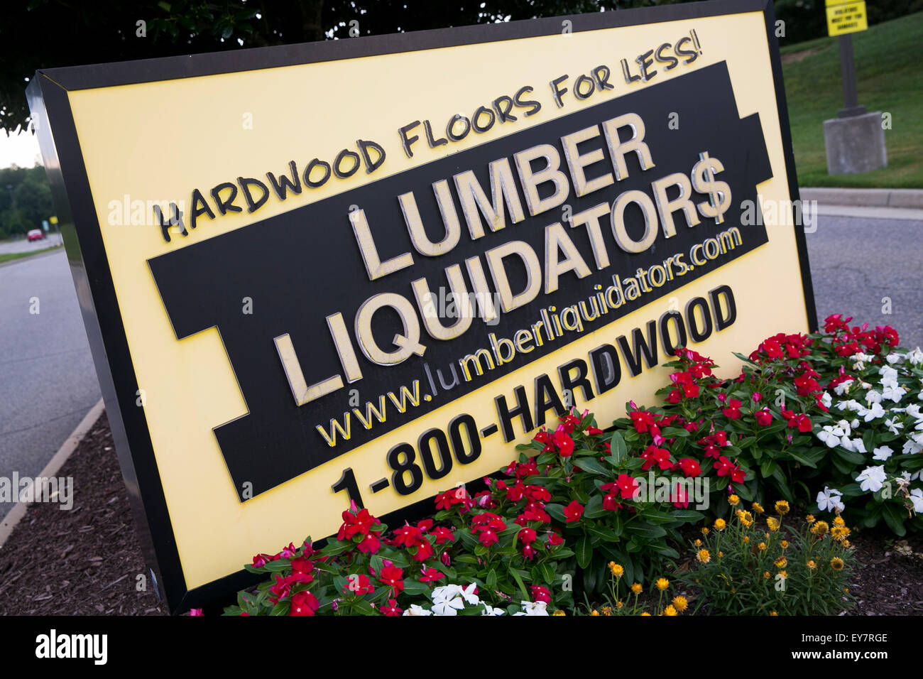 A logo sign outside of the headquarters of Lumber Liquidators, Inc., in
