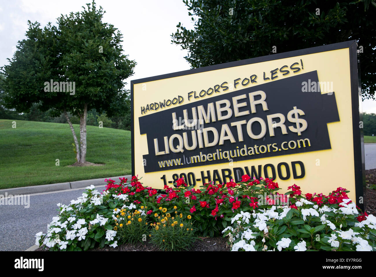 A logo sign outside of the headquarters of Lumber Liquidators, Inc., in Toano, Virginia on July 18, 2015. Stock Photo