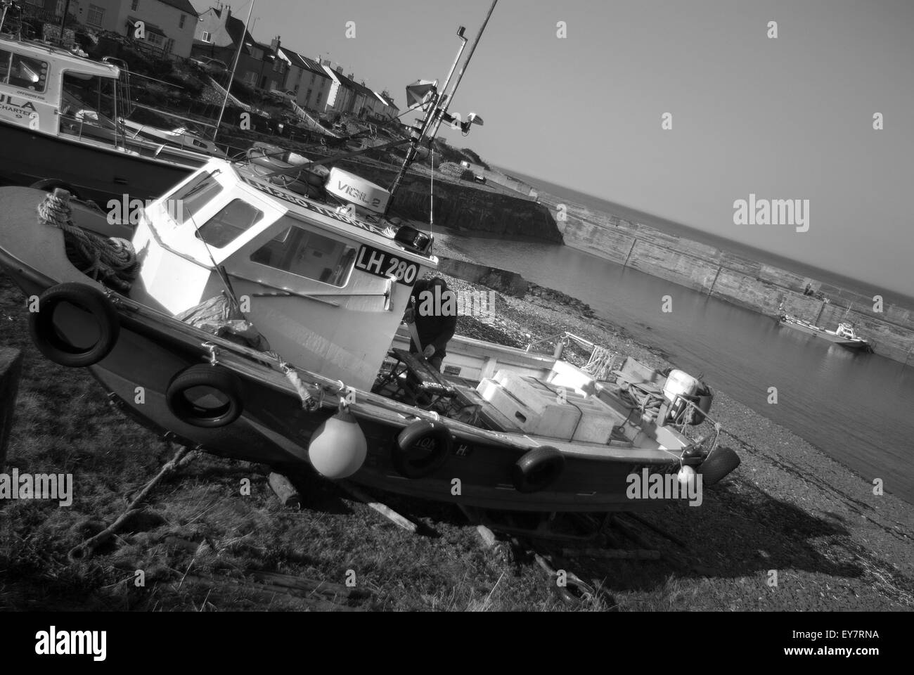 Wooden pier fishing boats Black and White Stock Photos & Images - Alamy