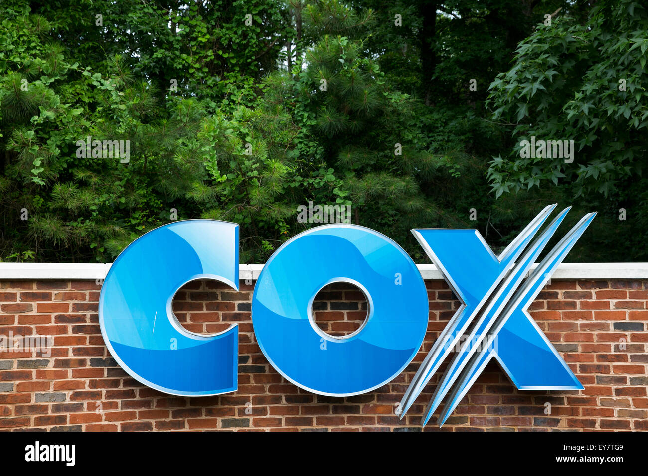 A Logo Sign Outside A Facility Occupied By Cox Communications Inc