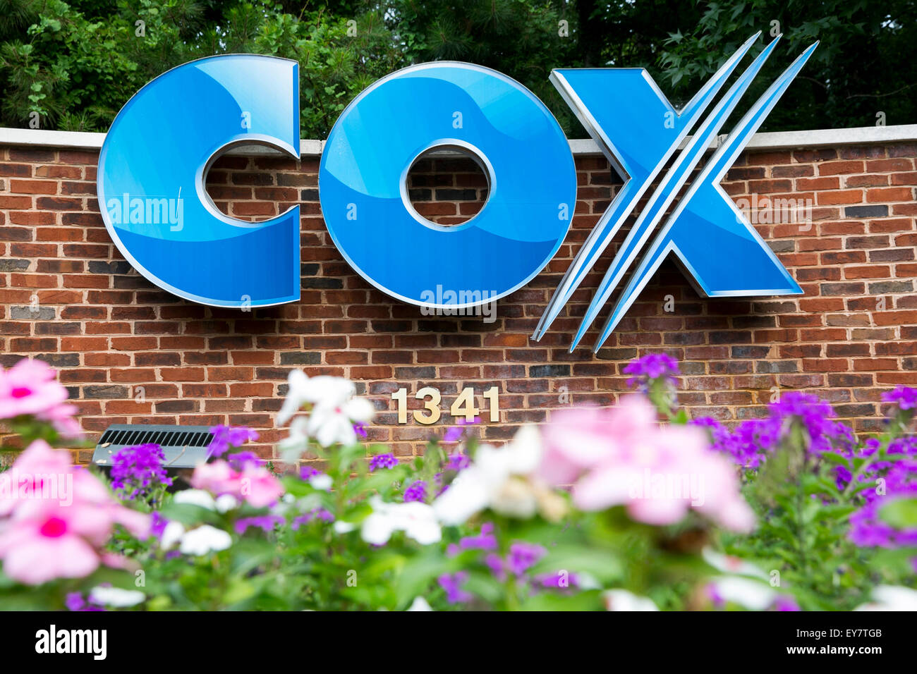 A logo sign outside a facility occupied by Cox Communications, Inc., in Chesapeake, Virginia on July 18, 2015. Stock Photo