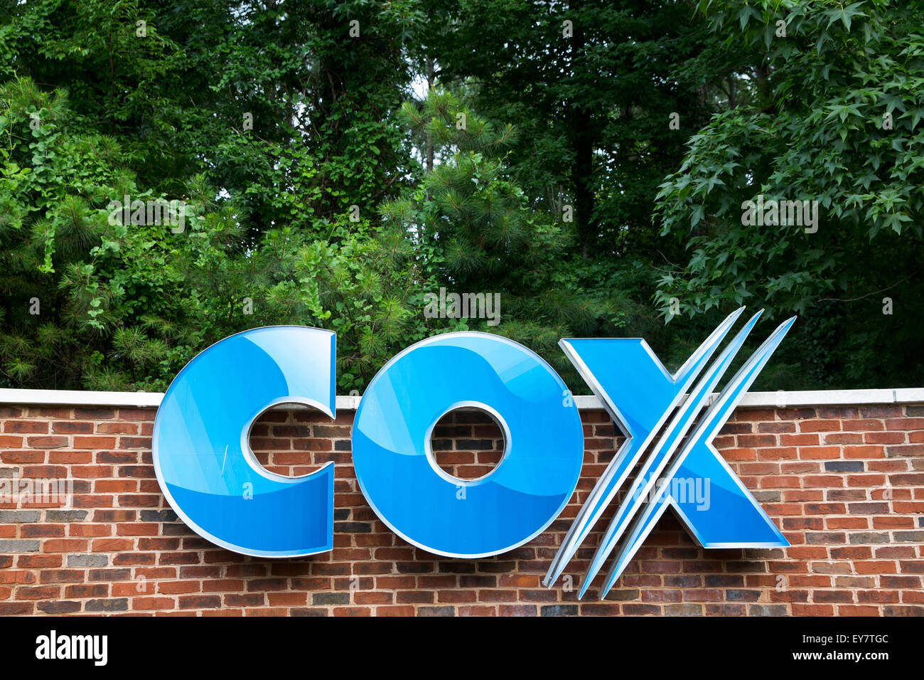 A logo sign outside a facility occupied by Cox Communications, Inc., in Chesapeake, Virginia on July 18, 2015. Stock Photo