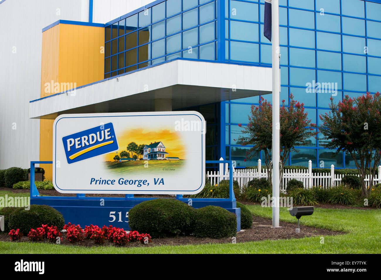 A logo sign outside of a chicken processing facility occupied by Perdue Farms, in Prince George, Virginia on July 19, 2015. Stock Photo