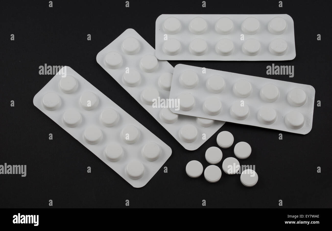 Tablet blister packs and open tablets Stock Photo