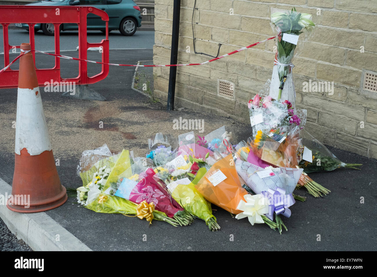 Bradford, UK. 23rd July, 2015. Flowers and messages left at site of the murder of Leroy Vanzie, 32, who was found in Corban Street, Bradford, at about 19:35 BST on Tuesday, but died later the same day Credit:  Paul Chambers/Alamy Live News Stock Photo