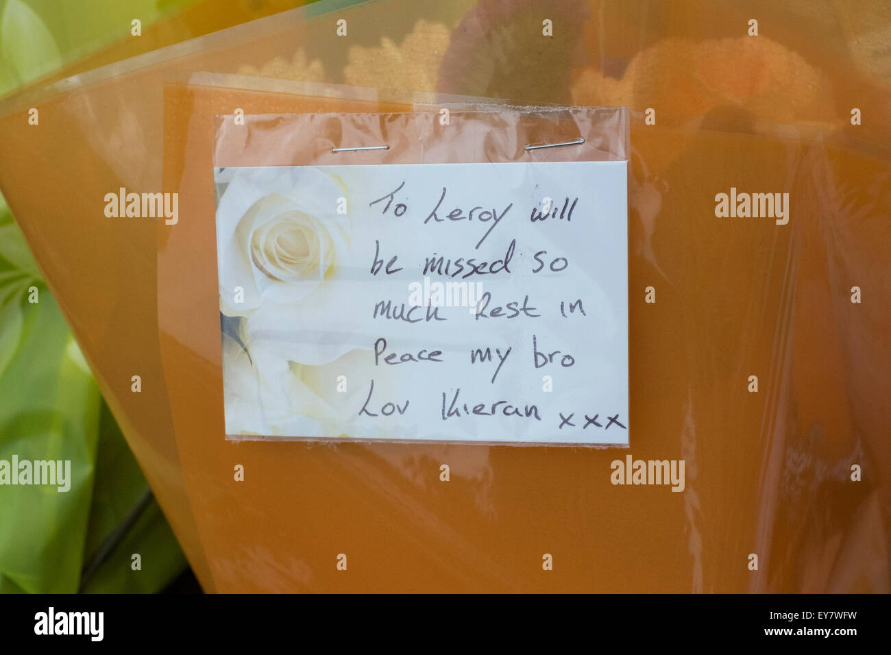 Bradford, UK. 23rd July, 2015. Flowers and messages left at site of the murder of Leroy Vanzie, 32, who was found in Corban Street, Bradford, at about 19:35 BST on Tuesday, but died later the same day Credit:  Paul Chambers/Alamy Live News Stock Photo