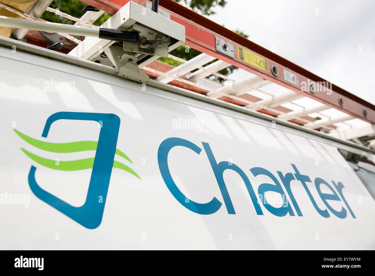 A Charter logo on a cable TV installation van belonging to Charter Communications, Inc. in Onancock, Virginia on July 18, 2015. Stock Photo
