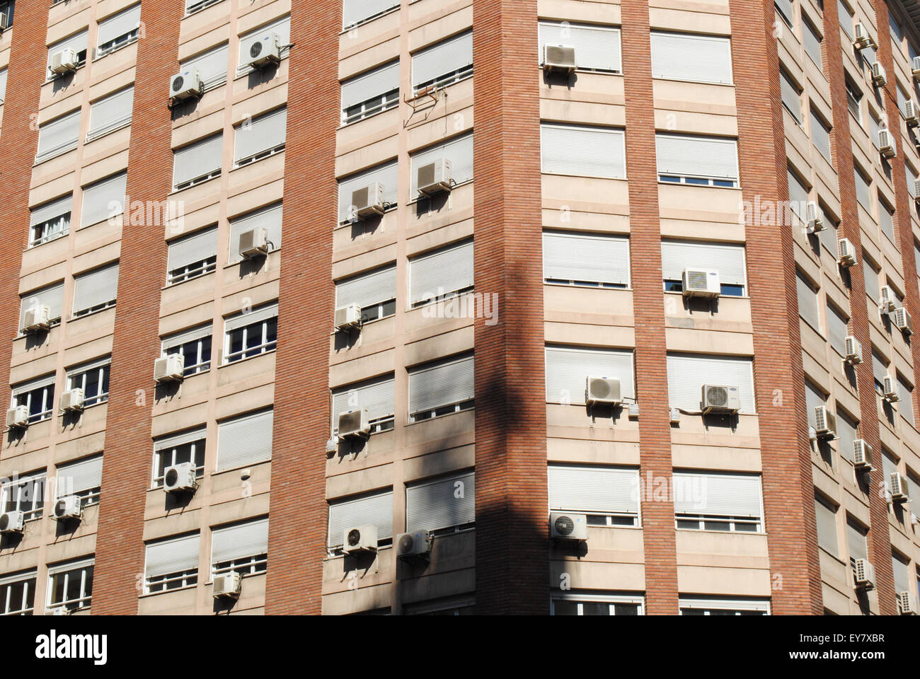 A tower block with several air conditioners on a hot summer day in Zaragoza, Spain. Stock Photo