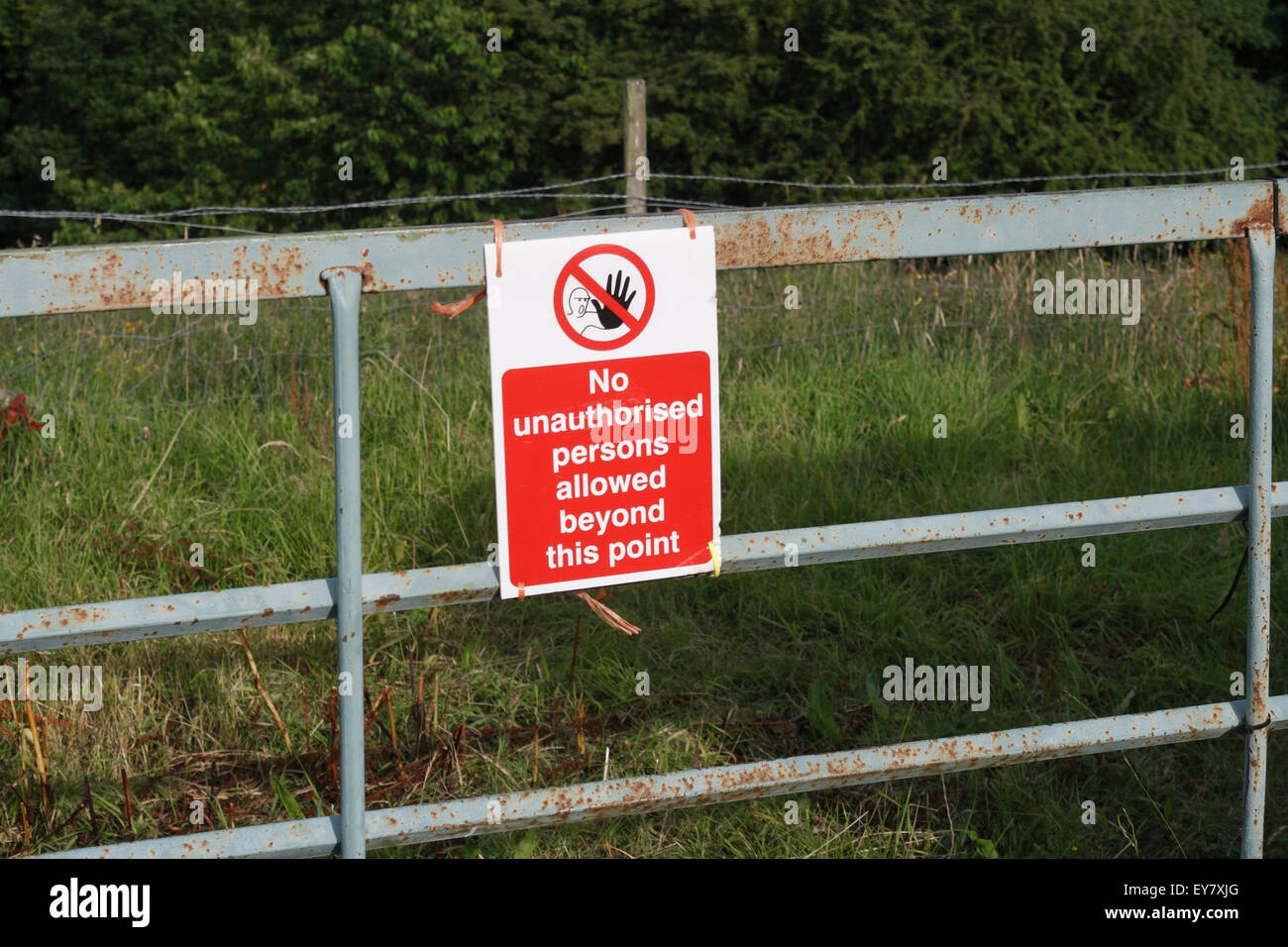 No unauthorised persons allowed beyond this point, sign on farm field ...