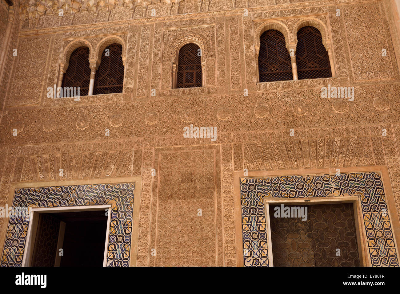 Ornate arabic designs in Mexuar courtyard entrance to the Comares Palace in Nasrid Palaces Alhambra Granada Stock Photo
