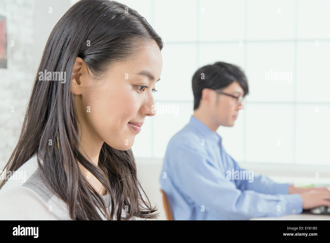 Young co-workers working in a stylish office Stock Photo