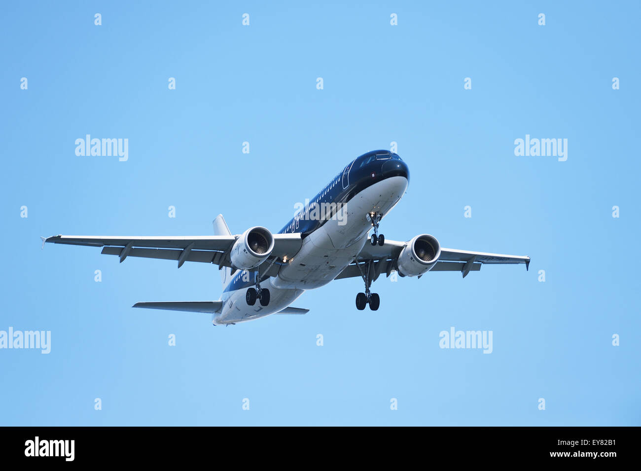 Airplane flying in the sky Stock Photo - Alamy