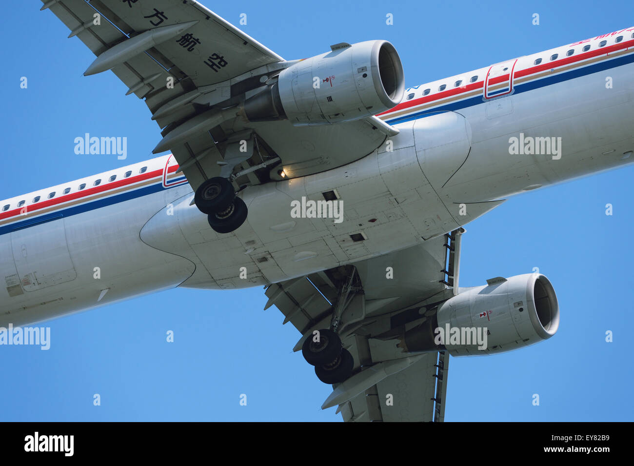 Airplane flying in the sky Stock Photo - Alamy