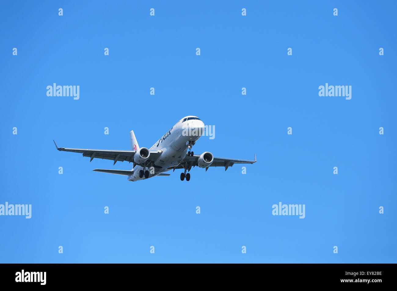 Airplane flying in the sky Stock Photo