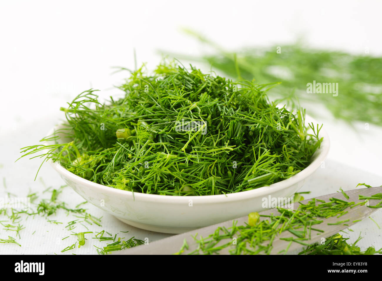 Bowl of fresh chopped dill leaves Stock Photo Alamy