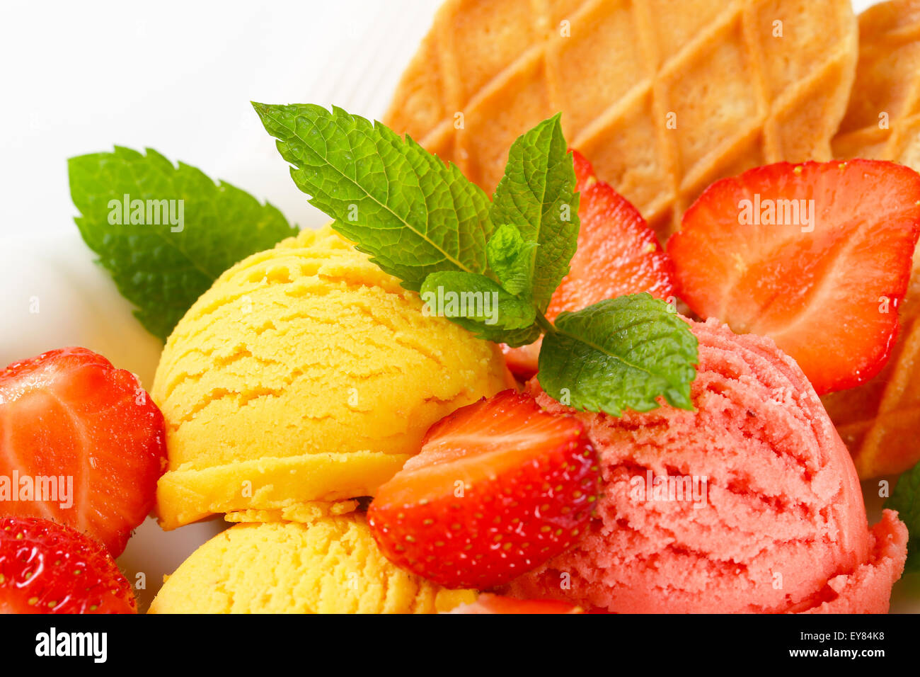 Ice cream with fresh strawberries and thin waffles Stock Photo