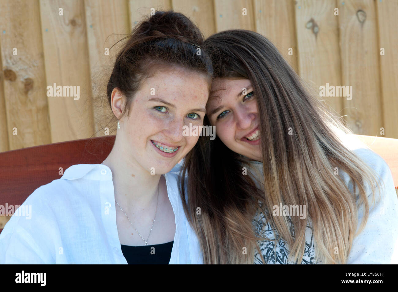 Portrait of two teenage girls smiling Stock Photo - Alamy