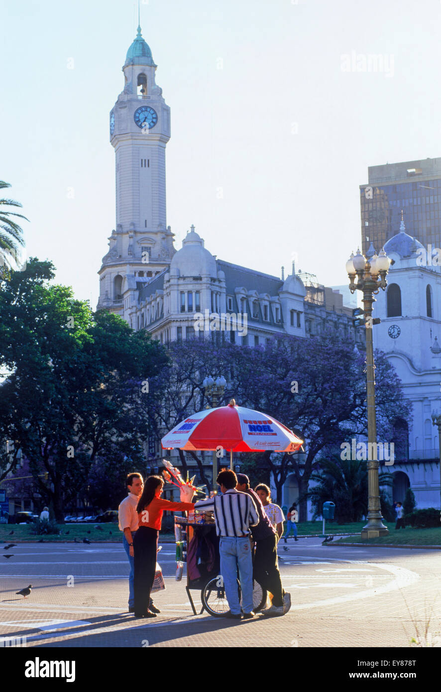 The Cabildo and Clock Tower at Plaza de Mayo with people on square buying ice cream in Buenos Aires Stock Photo