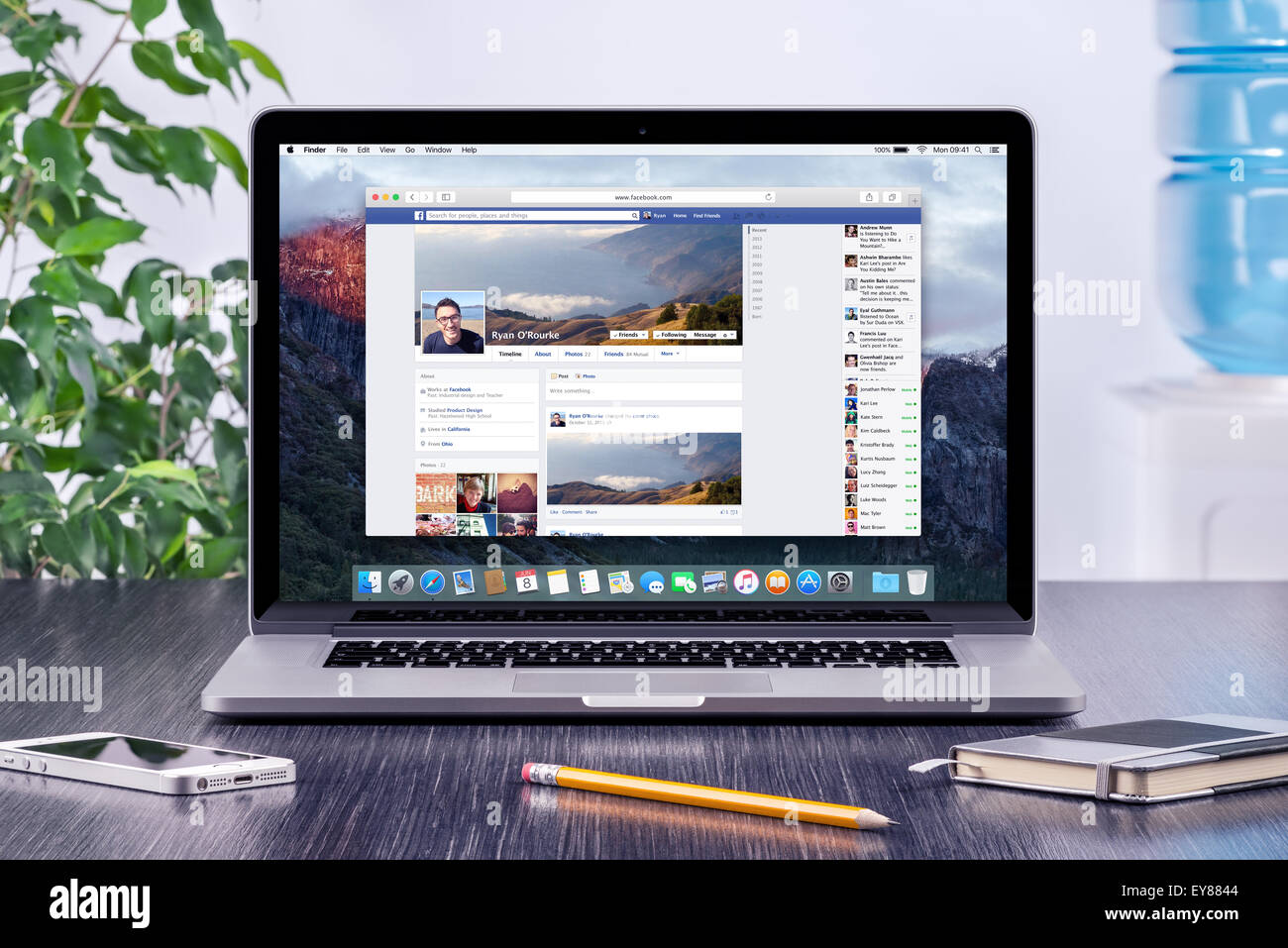 Varna, Bulgaria - May 31, 2015: Facebook Timeline in user profile on Apple Macbook Pro Retina screen that is on wooden desk. Stock Photo