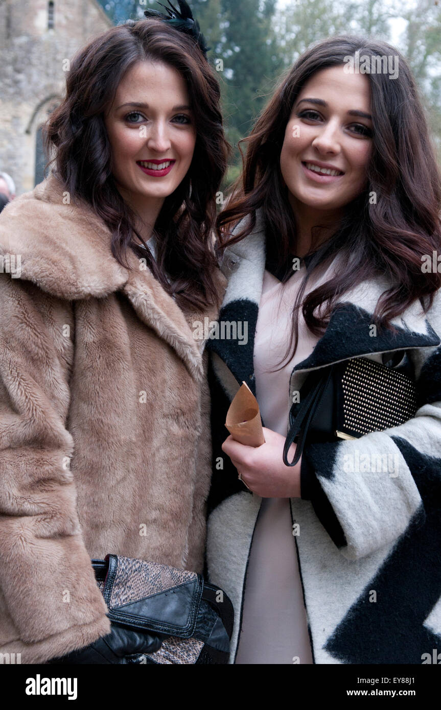 Two women with long dark hair smiling Stock Photo