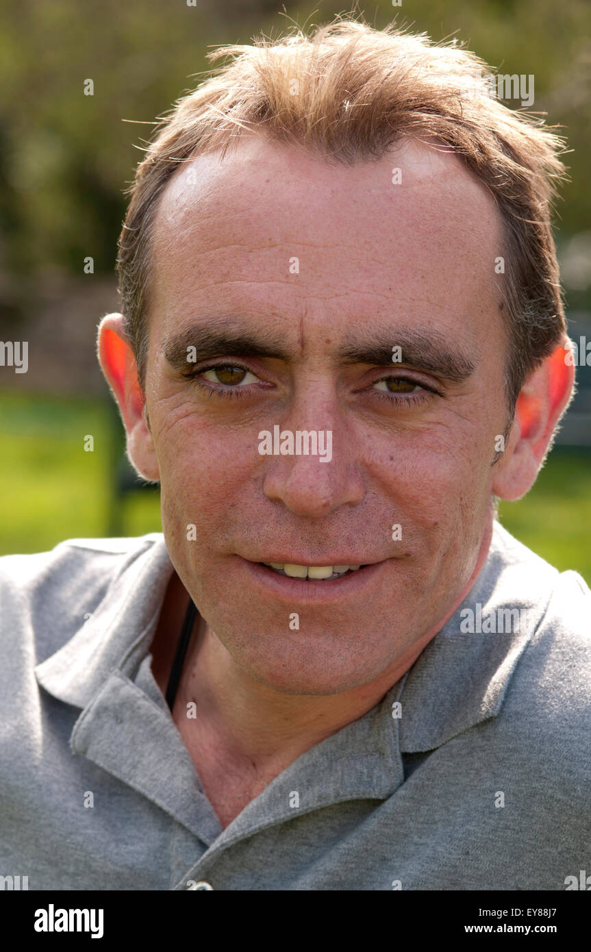 Man with receding hairline, looking at camera smiling Stock Photo