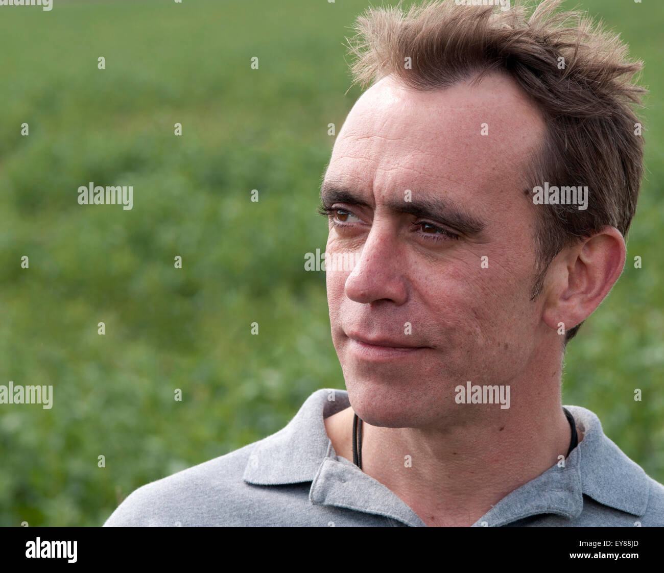 Head shot of man with receding hairline looking thoughtful Stock Photo