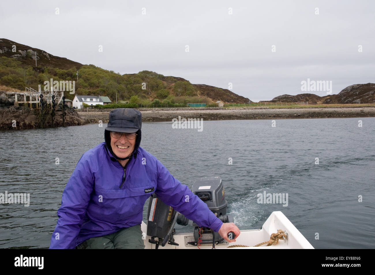Mature man driving a boat Stock Photo - Alamy