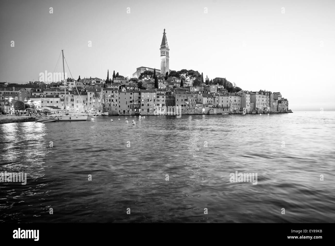 A view of the old city core with the Saint Euphemia church and bell tower at sunset in Rovinj, Croatia. Stock Photo
