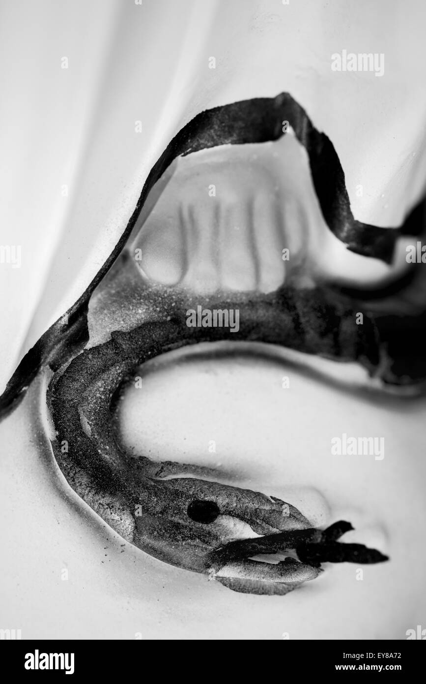 Virgin Mary statue. Detail. Foot resting on a serpent Stock Photo