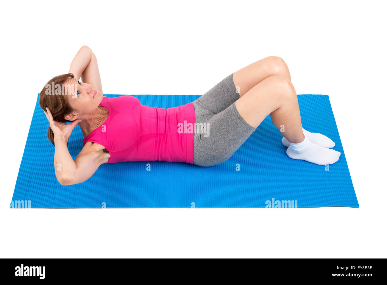 Sporty woman doing sit-ups Stock Photo
