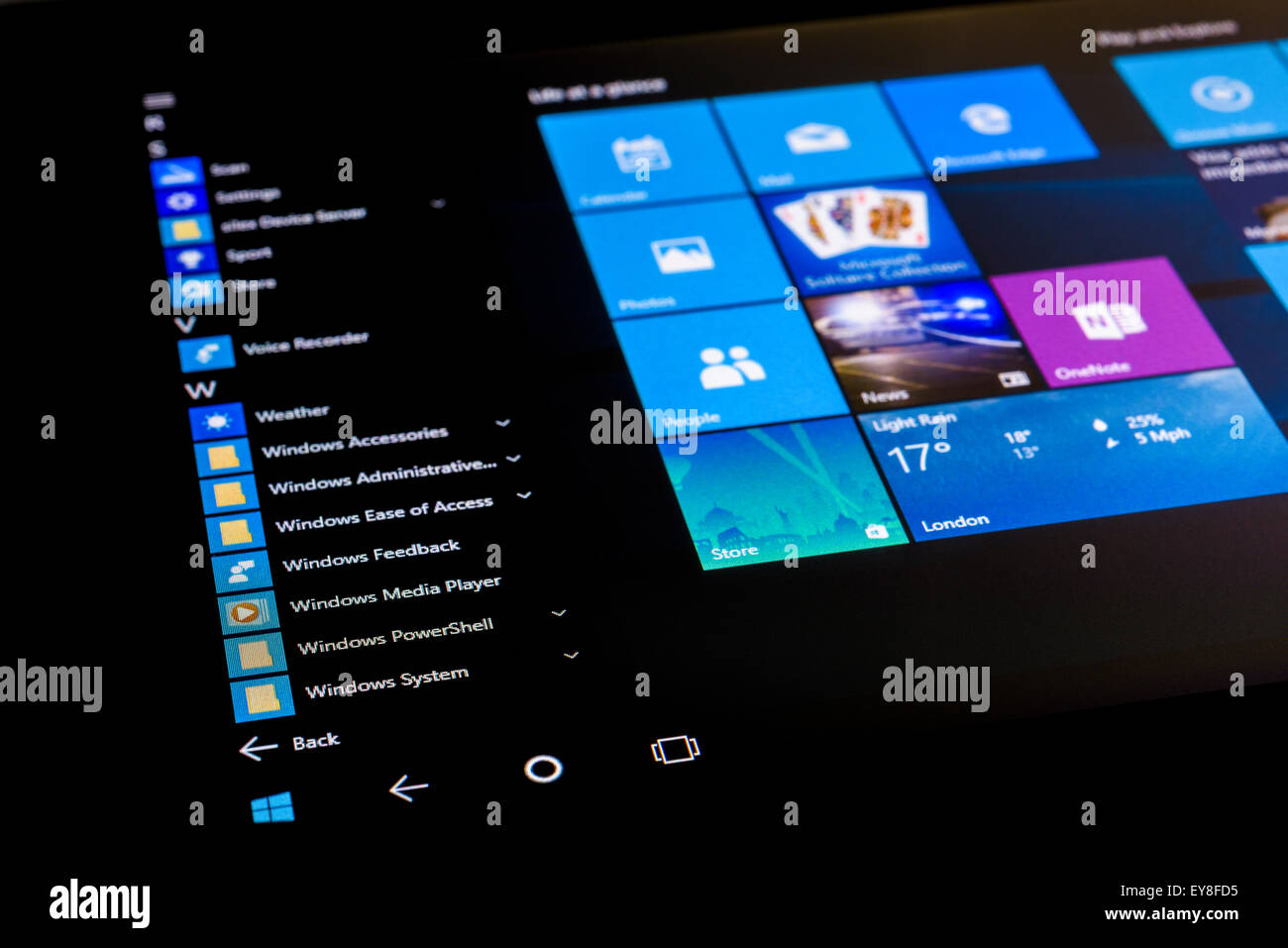 The start menu of Microsoft Windows 10 Operating System on a touch screen tablet in tablet mode. Stock Photo