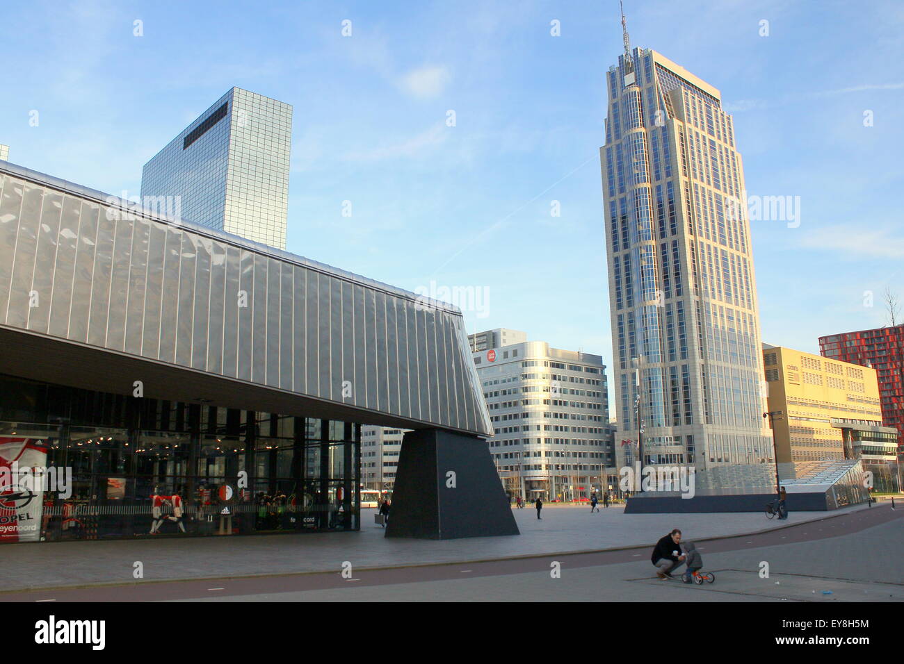 Side entrance to Rotterdam Centraal railway station, Rotterdam, The Netherlands. Highrise Manhattan Hotel in the background Stock Photo