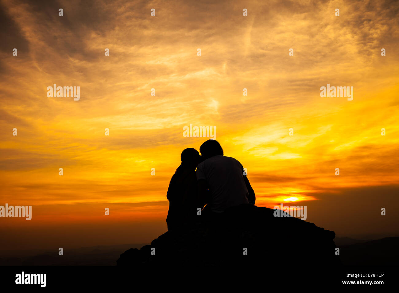 Silhouette of loving couple in sunset Stock Photo - Alamy