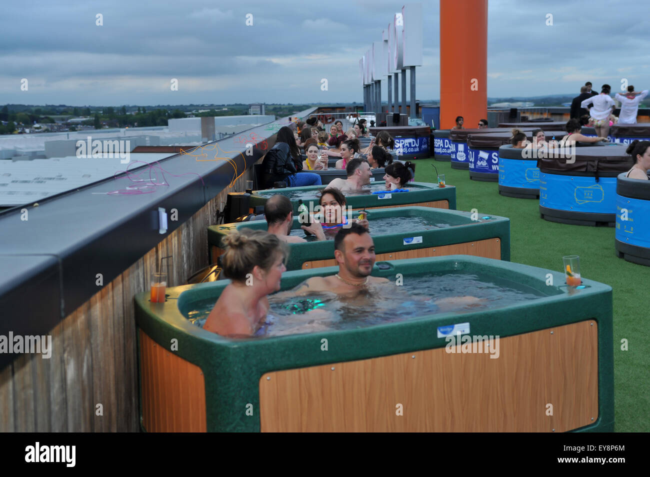 Revellers enjoy the Spa Tub Cinema on top of Fort Dunlop during the Pink  for Pride Festival Featuring: Atmosphere Where: Birmingham, United Kingdom  When: 22 May 2015 Stock Photo - Alamy