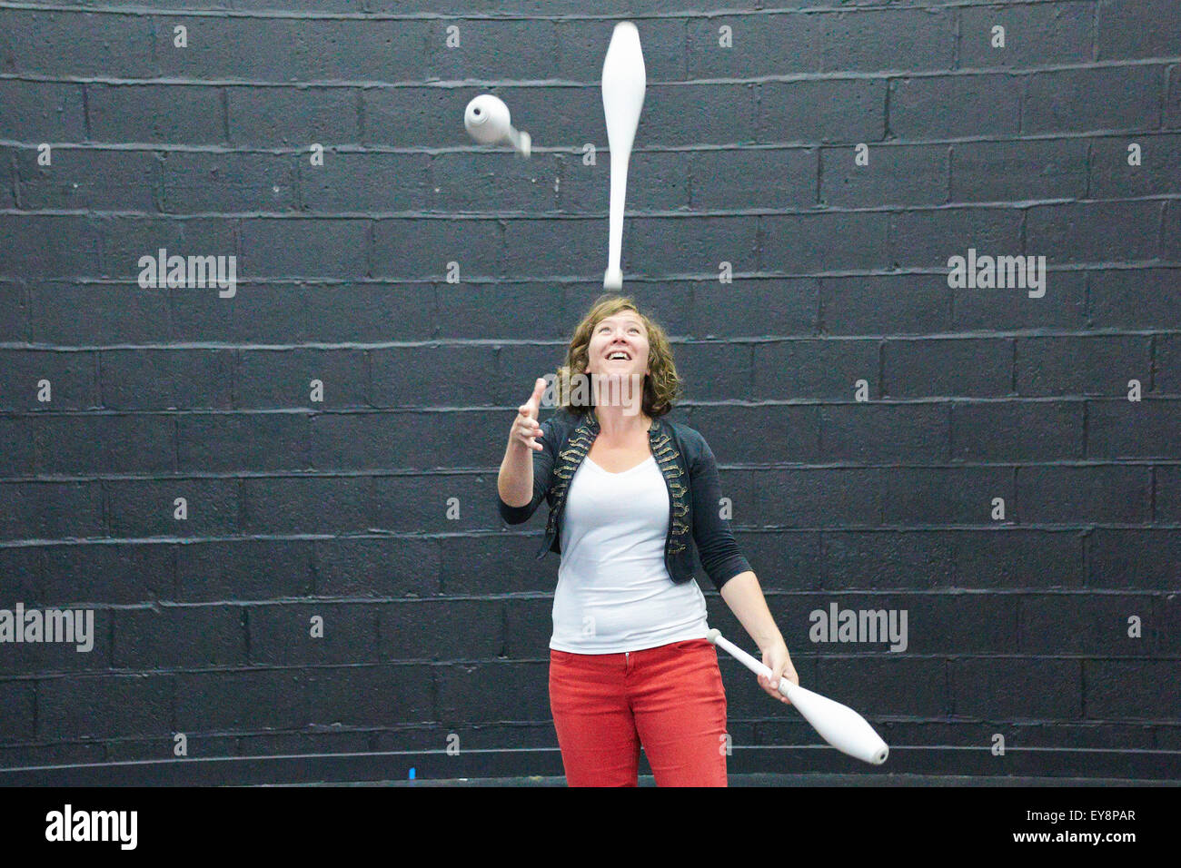 A performer juggles clubs at a circus skills workshop at Pegasus Theatre in Oxford. Stock Photo