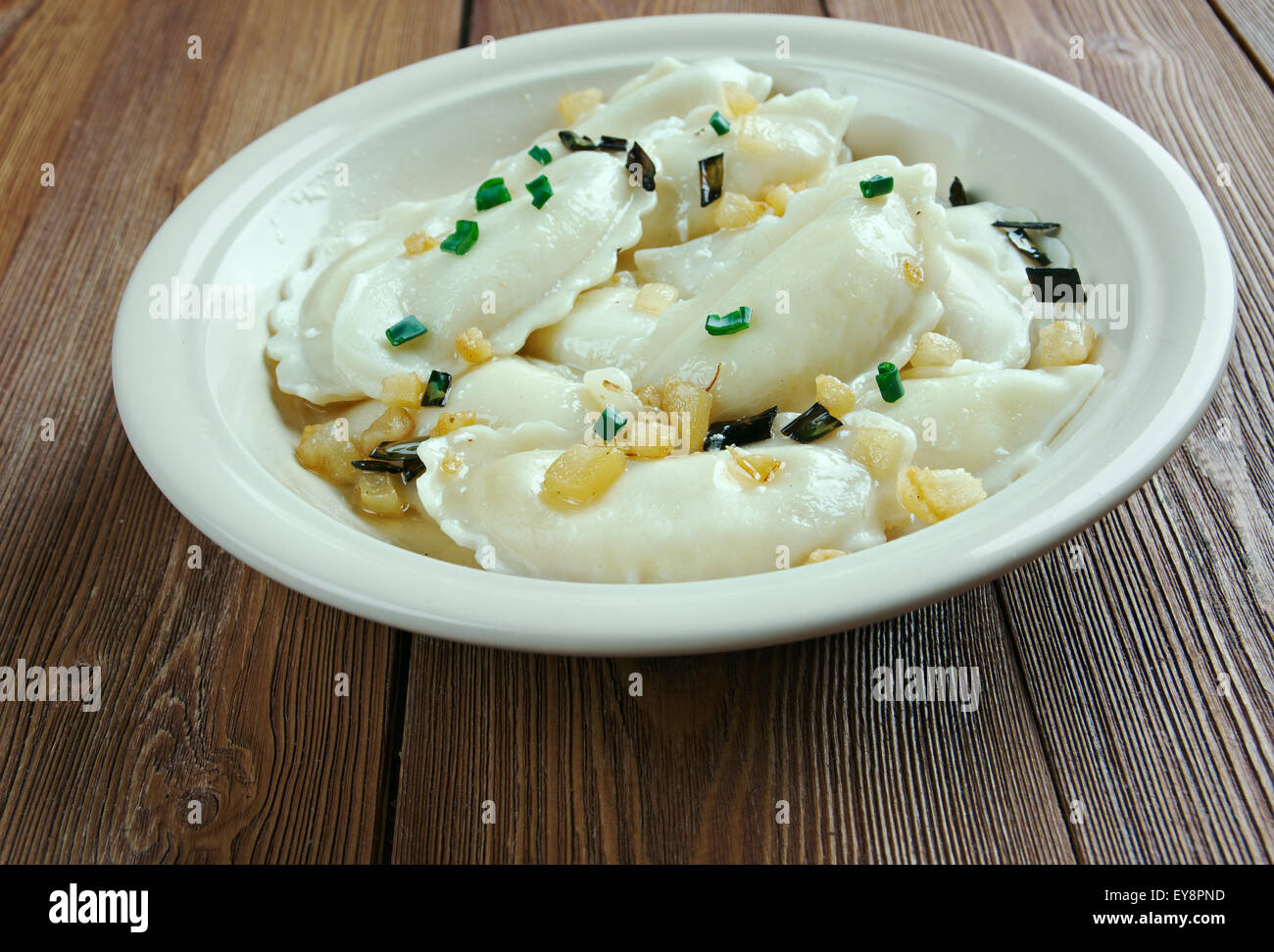 perogi dumplings of unleavened dough first boiled, which various