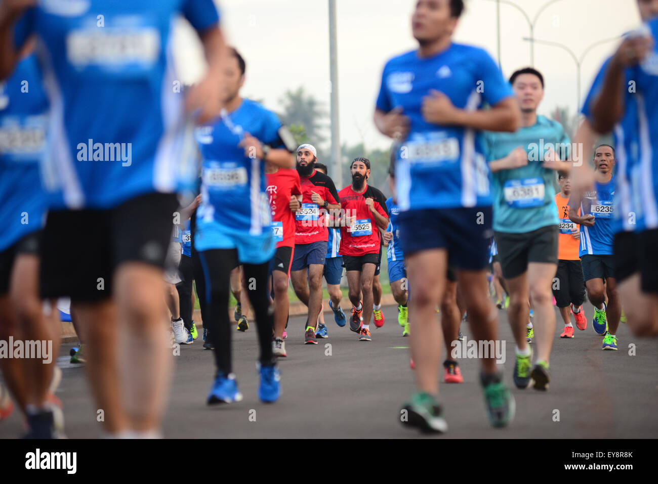 Participants running during  "Pocari Sweat Run Indonesia 2015" in Tangerang, Banten, Indonesia. Stock Photo