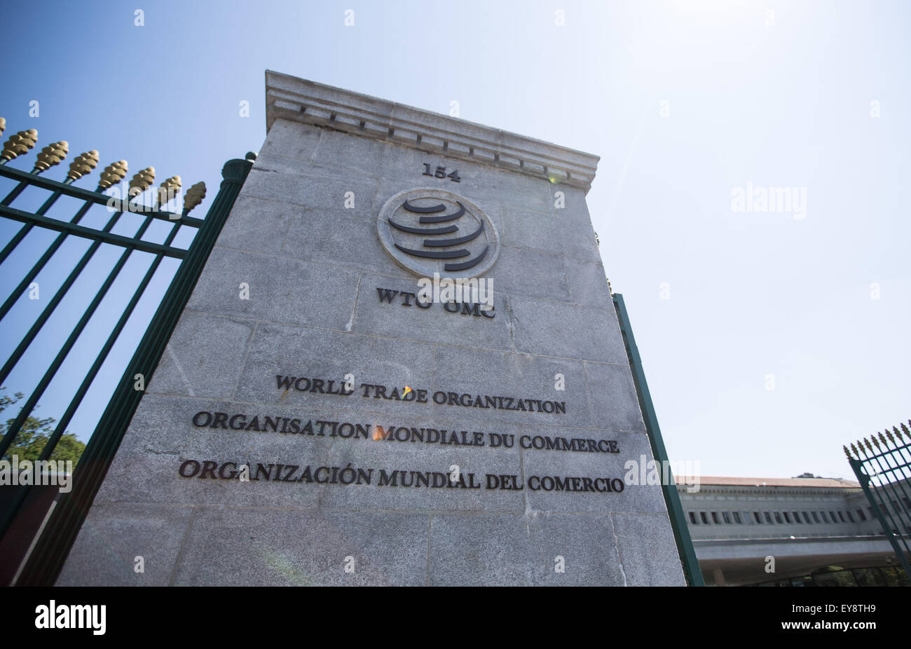 Geneva, Switzerland. 24th July, 2015. The World Trade Organization (WTO) logo is seen at the entrance of the WTO headquarters in Geneva, Switzerland, July 24, 2015. WTO members representing major exporters of information technology products agreed on Friday to eliminate tariffs on more than 200 such products, according to WTO's press release. © Xu Jinquan/Xinhua/Alamy Live News Stock Photo